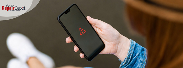 Phone with a warning sign
