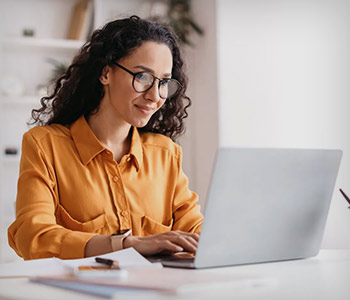 Woman editing PDF on laptop