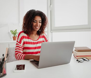 Woman using laptop for business or personal use