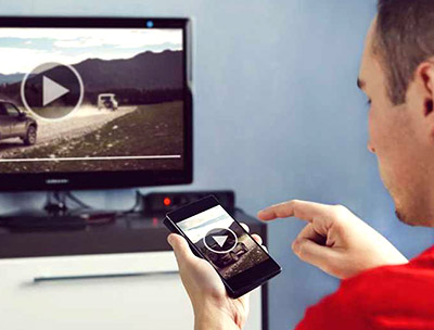 Man casting YouTube Video from phone to tv