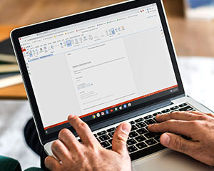 Man typing on Chromebook keyboard