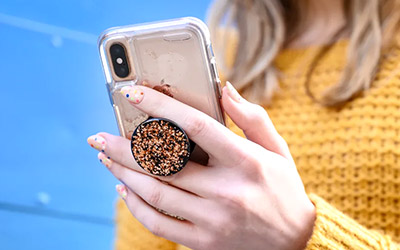 iPhone with clear case and PopSocket
