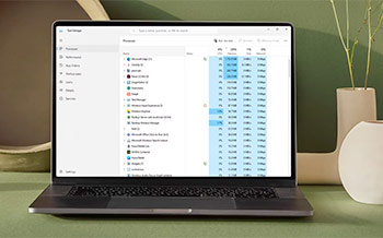 Task Manager open on laptop to optimize