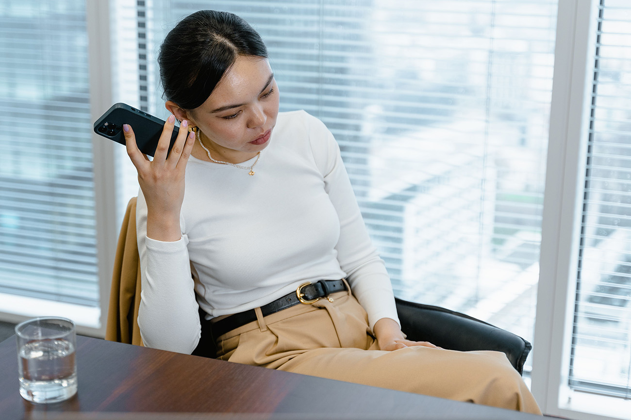 Person trying to hear audio from a phone